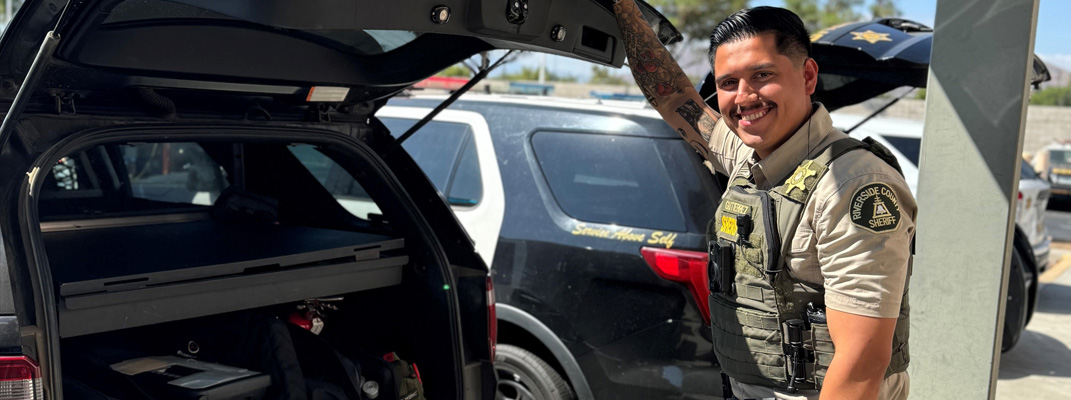 Policeman with his car.